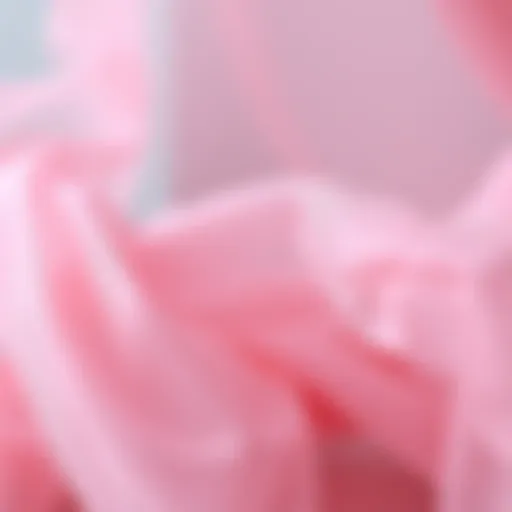 Delicate Texture of Pink Tulle Fabric A close-up of pink tulle fabric showcasing its delicate texture and intricate details.