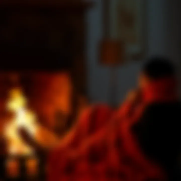 Person enjoying a blanket by the fireplace